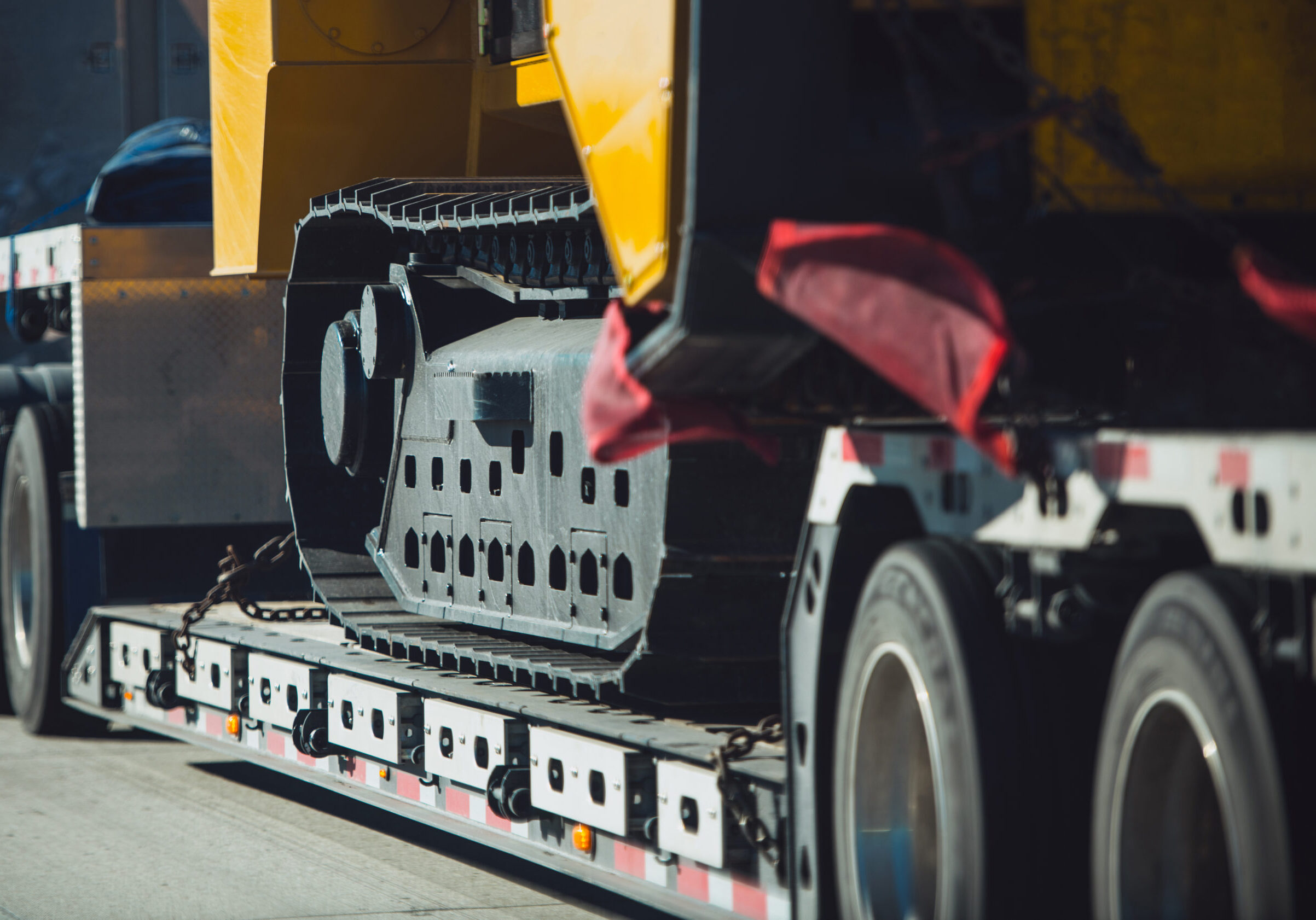 Long Haul Heavy Duty Construction Machinery Transportation on a Semi Truck Trailer. Excavator Delivery.
